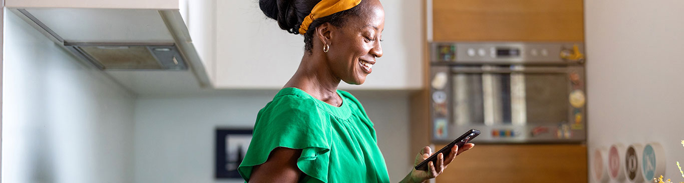 Woman smiling looking at phone