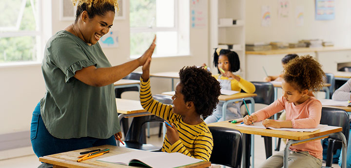 Teacher and student high-five